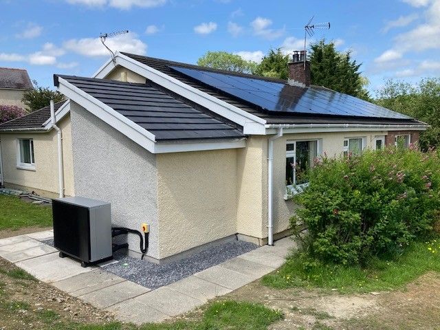House in Carmarthen with solar panels and air source heat pump, installed in 2025