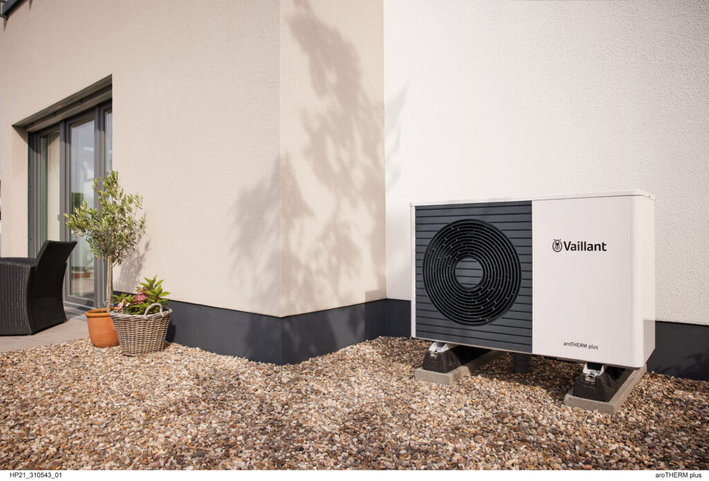 Domestic air-source heat pump installed on a Welsh home exterior