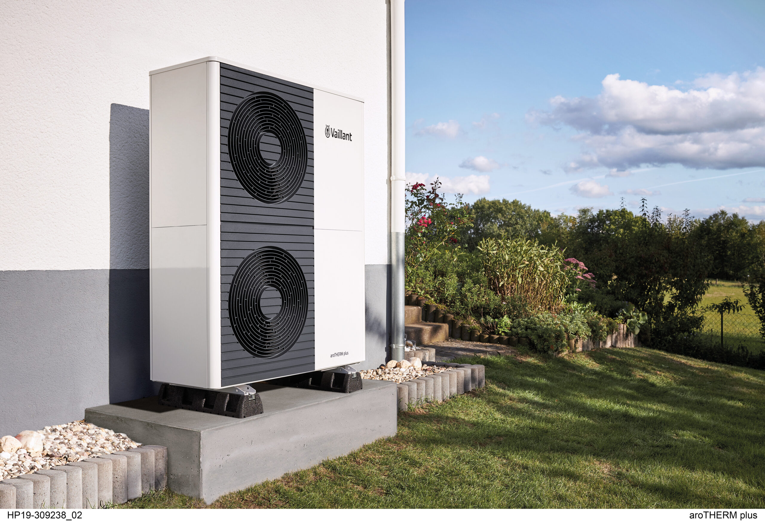 Air-source heat pump outdoor unit installed in a yard in Wales