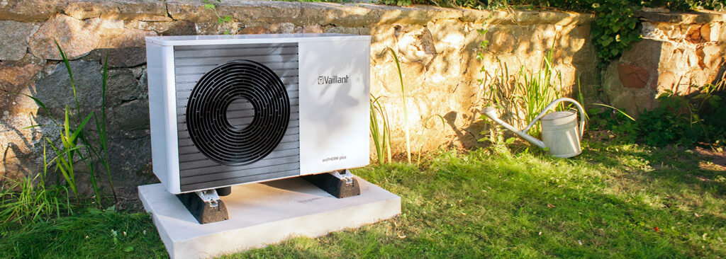 Domestic air-source heat pump installed on a Welsh home exterior Vaillant