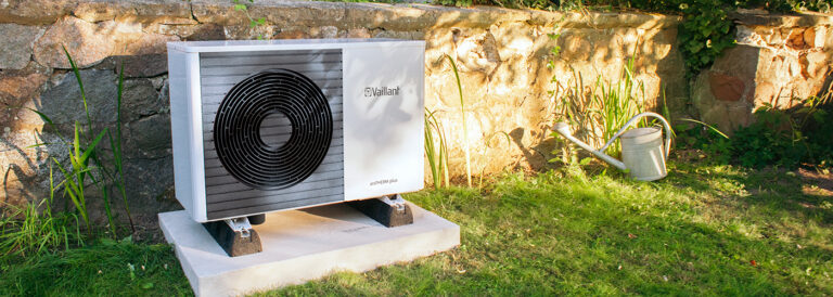Domestic air-source heat pump installed on a Welsh home exterior Vaillant