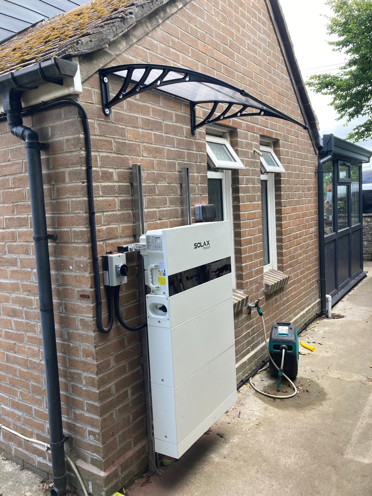 Home battery system storing excess solar energy for evening household use