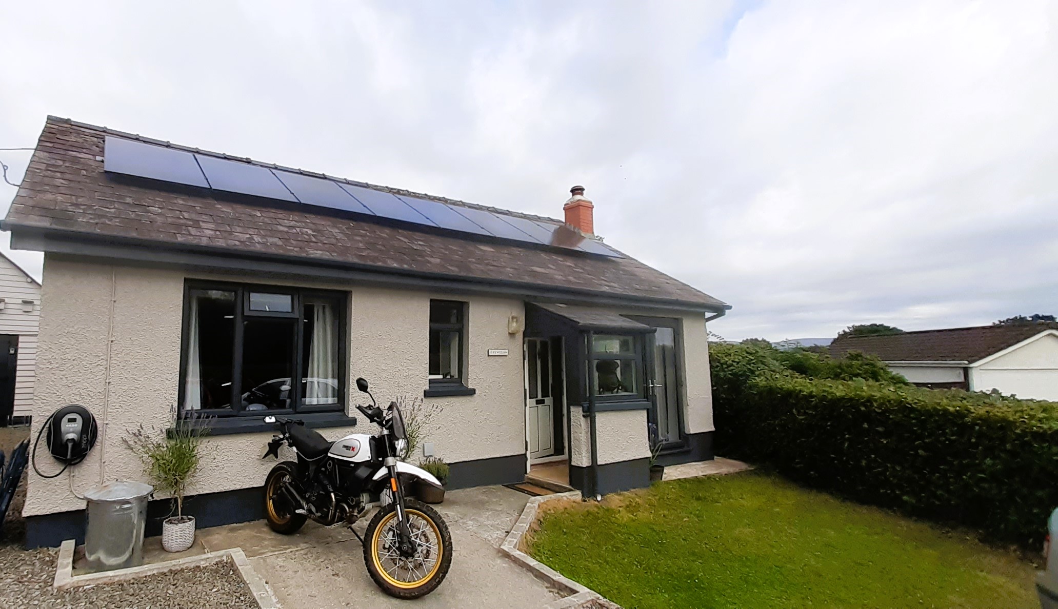 Residential solar panel installation on a UK home requiring DNO approval.